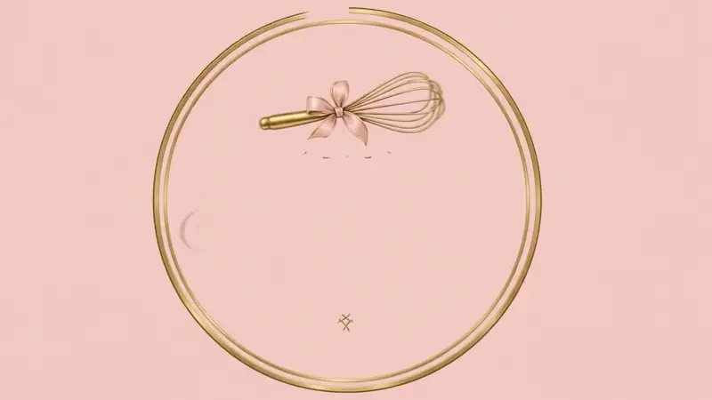 A pink buttercream swirl on a cupcake in a gold liner, on a marble counter with a gold whisk